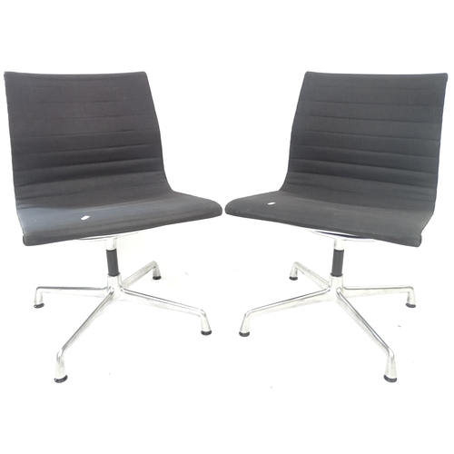 2098 - A pair of Vitra Eames EA108 aluminium swivel chairs, with maker's label to base