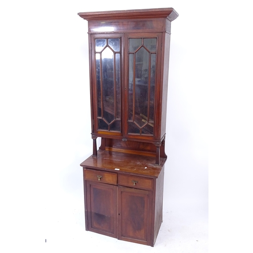 2101 - An early 20th century mahogany bookcase on cabinet, the top section having 2 glazed doors and the ot... 