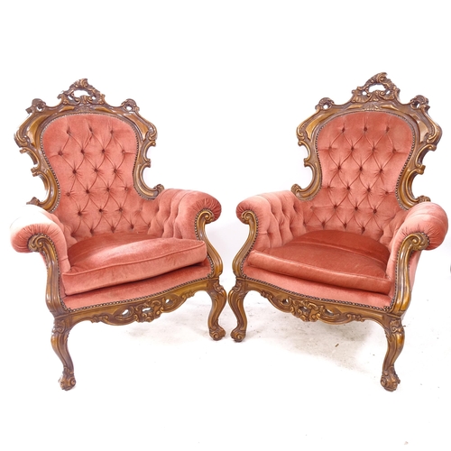 2116 - A pair of reproduction Continental armchairs, with walnut show wood  and carved decoration