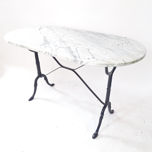 2123 - An oval marble-topped garden table, on cast-iron frame, L120cm, H71cm, D60cm