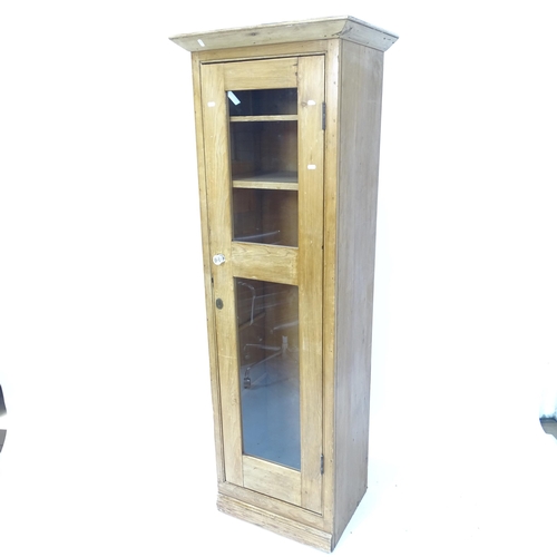 2127 - A pine larder cupboard with single glazed door and shelved interior, W61cm, H181cm, D44cm