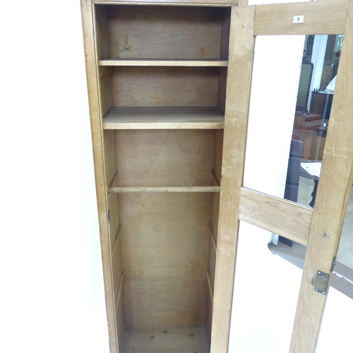 2127 - A pine larder cupboard with single glazed door and shelved interior, W61cm, H181cm, D44cm