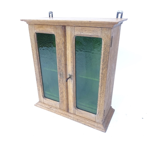 2130 - A Vintage pine 2-door hanging cabinet, with green glazed doors, W45cm, H50cm, D19cm (with key)