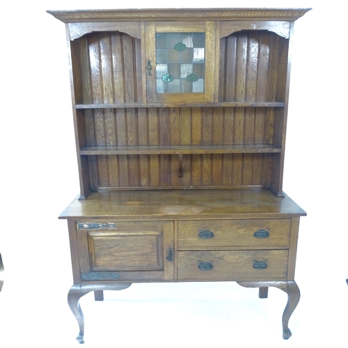 2131 - An early 20th century oak Arts and Crafts 2-section dresser, with single lead-light glazed cupboard ... 