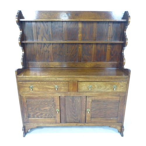 2132 - A 1920s oak Art and Crafts Cotswold School Welsh dresser, by Greening of Oxford for Heals, W132cm, H... 