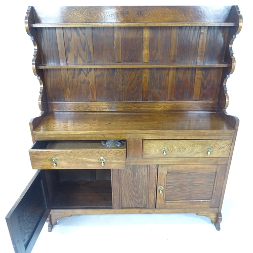 2132 - A 1920s oak Art and Crafts Cotswold School Welsh dresser, by Greening of Oxford for Heals, W132cm, H... 