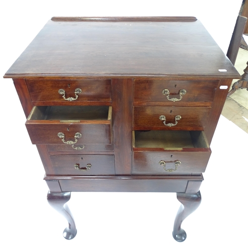 2133 - An early 20th century oak chest on stand, with 8 drawers, on cabriole legs with spade feet, W79cm, H... 