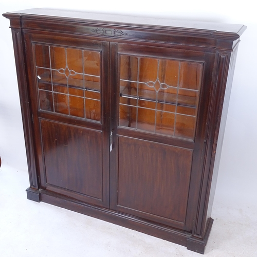 2135 - An Edwardian mahogany bookcase, with 3 adjustable shelves and 2 leadlight glazed panelled doors, W14... 