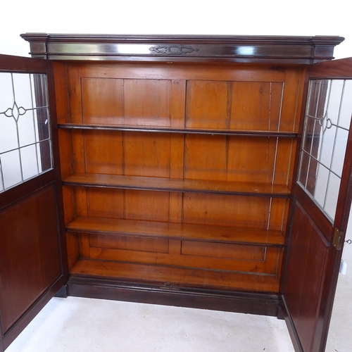 2135 - An Edwardian mahogany bookcase, with 3 adjustable shelves and 2 leadlight glazed panelled doors, W14... 