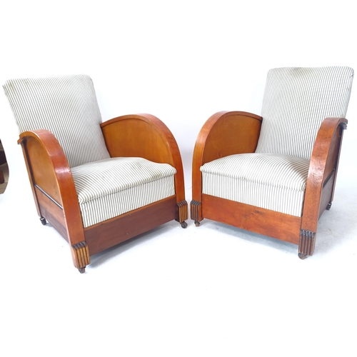 2136 - A pair of 1920s Art Deco lounge chairs, with wooden casters marked Canada