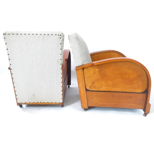 2136 - A pair of 1920s Art Deco lounge chairs, with wooden casters marked Canada