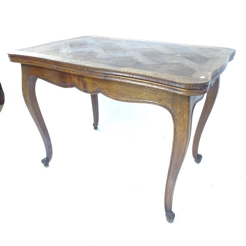 2137 - A parquetry-topped French draw leaf dining table, L110cm extending to 170cm, H75cm, D69cm