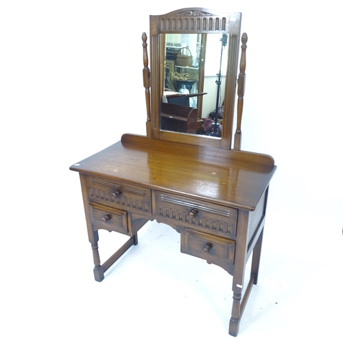 2139 - A mid-century Ipswich oak design dressing table, with mirror-back and 4 drawers, W94cm, H148cm, D47c... 