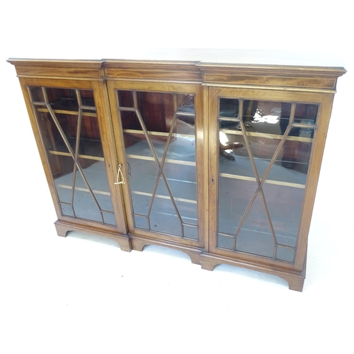 2148 - An Edwardian mahogany break-front bookcase, with 3 glazed doors and inlaid decoration, W152cm, H111c... 