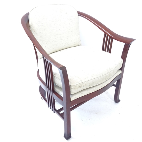 2167 - A Giorgetti tub armchair, with fretwork back and sides, with maker's marks