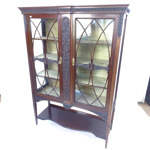 2169 - A reproduction mahogany display cabinet, with 2 glazed doors and carved decoration, W123cm, H170cm, ... 