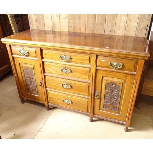 2181 - An early 20th century Art Nouveau mahogany dresser base, with 6 drawers and 2 cupboards, with carved... 