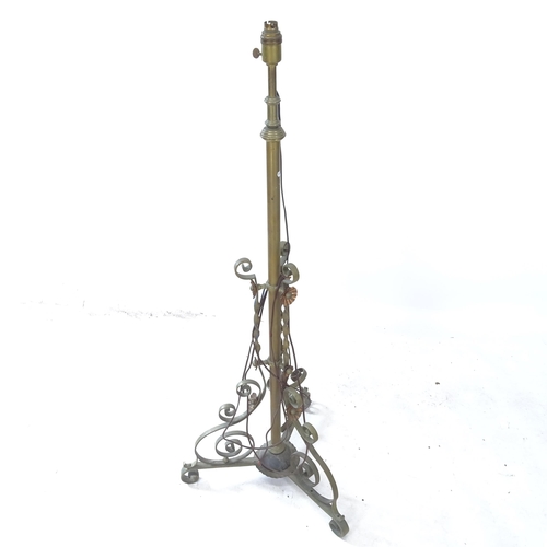 2377 - A brass telescopic standard lamp on tripod base, maximum height to bayonet fitting 155cm