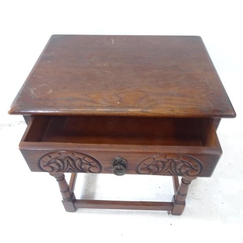 2378 - A reproduction oak lamp table, with single frieze drawer and carved decoration, W57cm, H65cm, D43cm