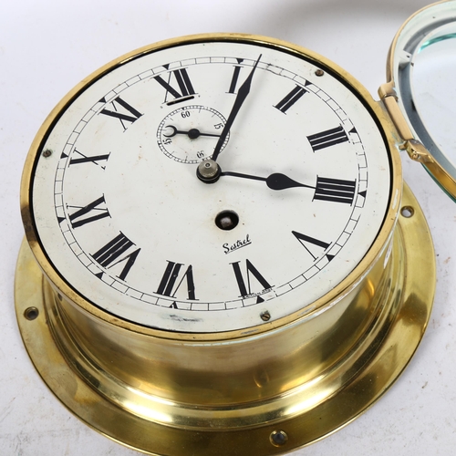 484 - A Sestrel brass-cased ship's bulkhead clock, diameter 19cm