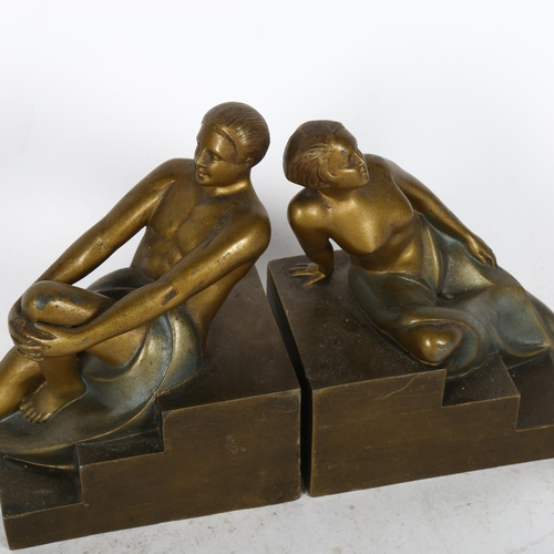 491 - A pair of Art Deco patinated spelter figure bookends, on stepped plinths, height 15cm