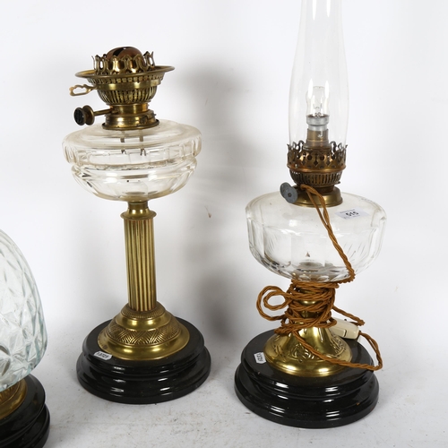 515 - A group of 3 lamps, including an embossed brass oil lamp with cut-glass font and chimney, height 55c... 