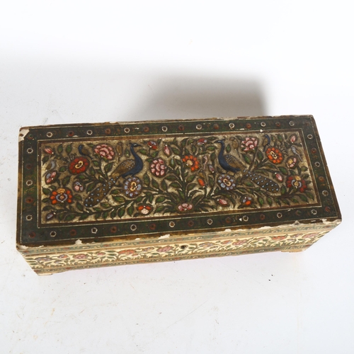 529 - A Middle Eastern Islamic wood casket, with relief moulded and painted decoration, length 29cm