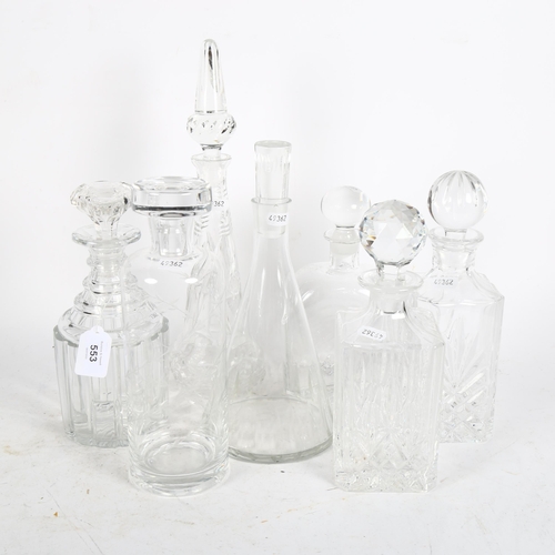 553 - 7 various crystal decanters and stoppers, tallest 37cm