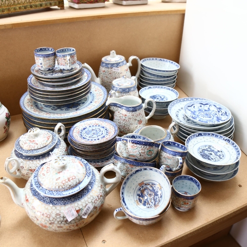 579 - Vintage Oriental teaware with rice grain decoration, including 2 teapots and jugs