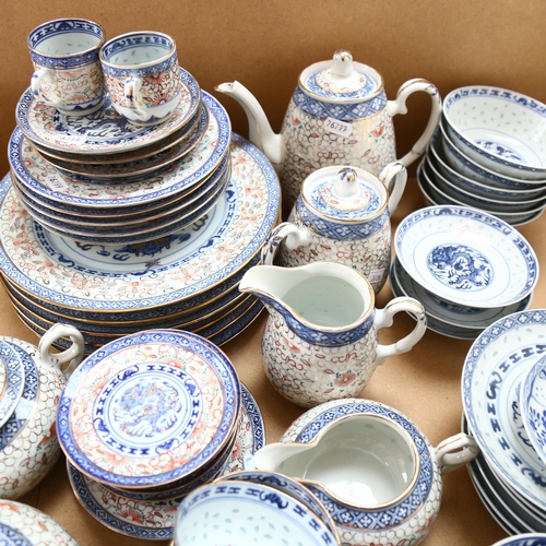 579 - Vintage Oriental teaware with rice grain decoration, including 2 teapots and jugs