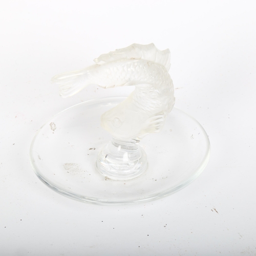 597 - LALIQUE - a frosted and clear glass ring dish, with a centrally raised salmon, etch mark to the base... 