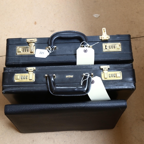 221 - 2 black leather briefcases, and another (3)