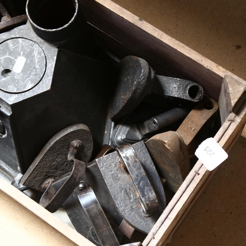 225 - An Antique French? cast-iron laundry stove, together with a collection of 10 various flat irons