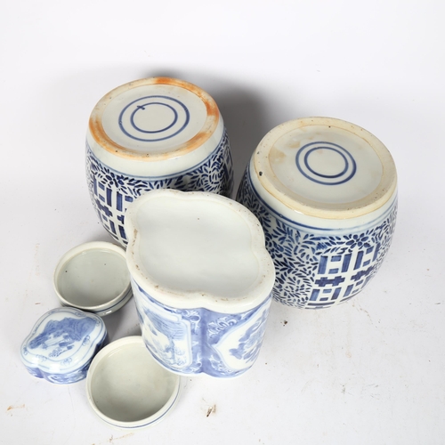 233 - A pair of Chinese blue and white jar and covers, height 23cm, and another of lobed form (3)