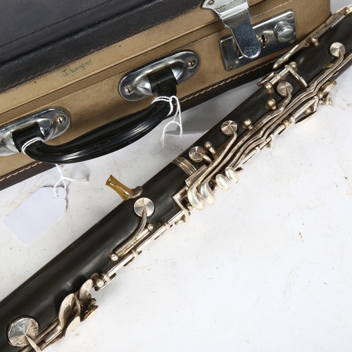 242 - A Chinese Hsinghai 4-section clarinet, in fitted hardshell case