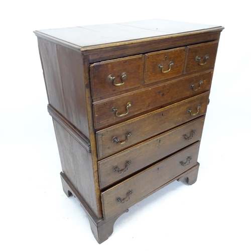 2534 - An 18th century secretaire chest, the fall-front revealing a fitted interior, with 3 long drawers be... 