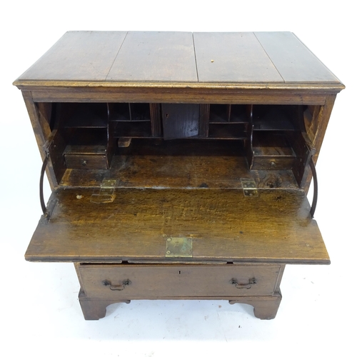 2534 - An 18th century secretaire chest, the fall-front revealing a fitted interior, with 3 long drawers be... 