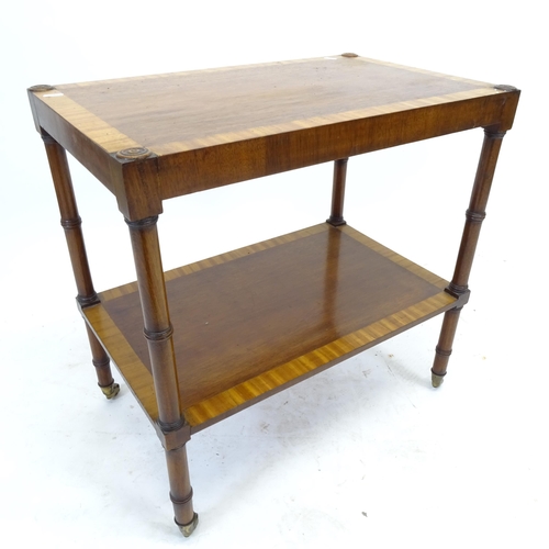 2541 - A crossbanded mahogany 2-tier tea trolley, W61cm, H61cm, D38cm