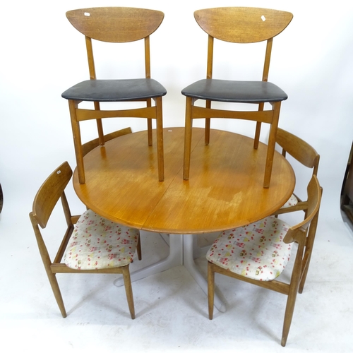 2543 - A set of 6 G Plan dining chairs, and a mid-century teak circular extending dining table with 2 spare... 