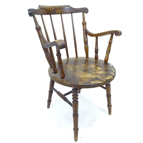 2549 - An Antique mahogany and elm-seated stick-back elbow chair