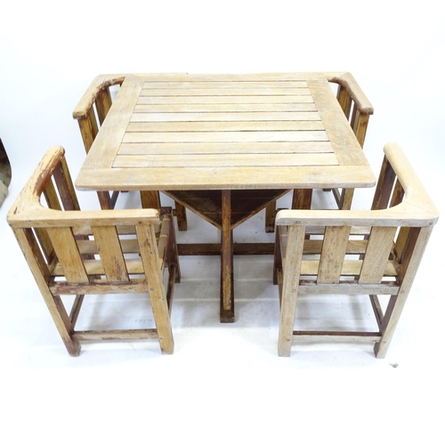 2551 - A Heals design teak garden table and chairs, the slatted table with 4 confirming tuck under chairs, ... 