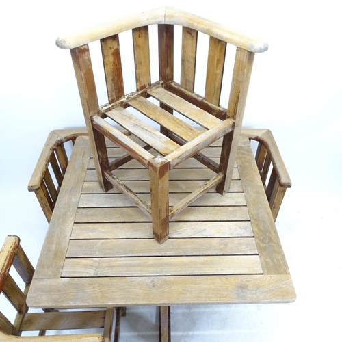 2551 - A Heals design teak garden table and chairs, the slatted table with 4 confirming tuck under chairs, ... 