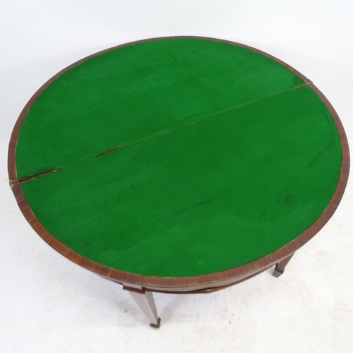 2567 - An Edwardian mahogany demilune fold over card table, on square tapered legs with spade feet, W100cm,... 