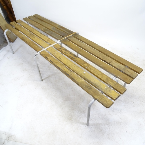 2580 - A pair of mid-century teak slatted benches, on tubular steel frames, L202cm, H45cm, D41cm