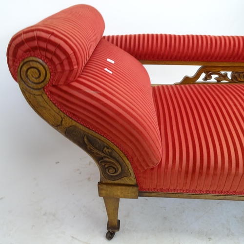 2582 - An early 20th century oak upholstered chaise longue, L178cm