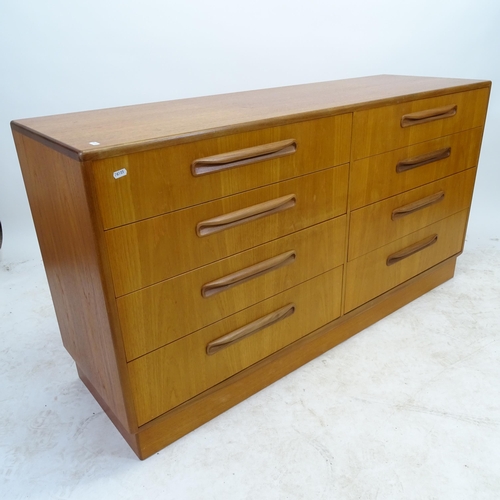 2588 - A teak mid-century side-by-side chest of 8 drawers, W142cm, H77cm, D45cm