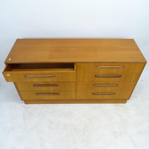 2588 - A teak mid-century side-by-side chest of 8 drawers, W142cm, H77cm, D45cm