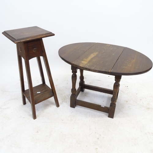 2589 - A small oak drop leaf table, L48cm, H46cm, D26cm, and an oak jardiniere stand, W25cm, H63cm