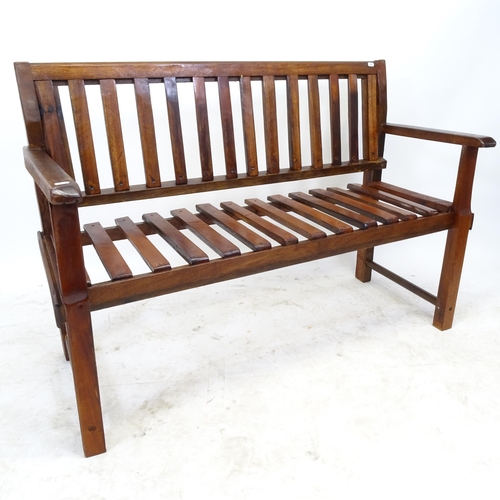 2600 - A mahogany slatted garden bench, by Clive Fredriksson, L122cm