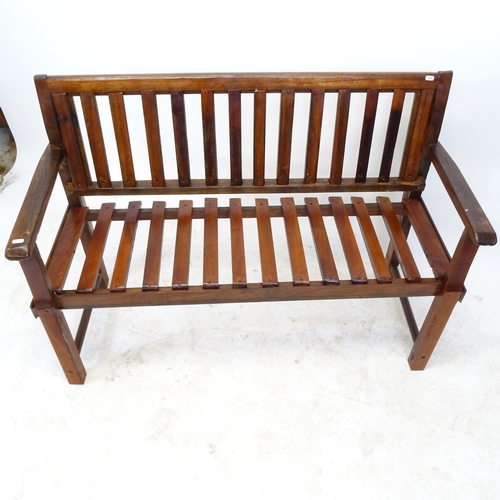 2600 - A mahogany slatted garden bench, by Clive Fredriksson, L122cm